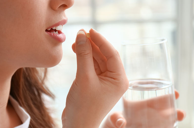 Woman With Glass Of Water Taking Rybelsus® For Weight Loss